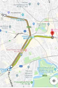 Map of Tokyo with a highlighted route passing Iidabashi, Tokyo Dome, hospitals, and museums.