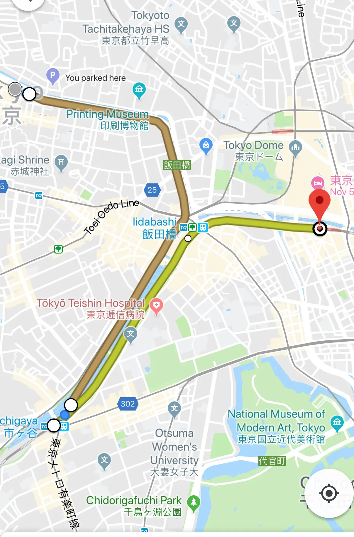 Map of Tokyo with a highlighted route passing Iidabashi, Tokyo Dome, hospitals, and museums.
